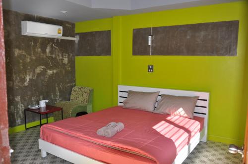 Tempat tidur dalam kamar di Feel Good Resort