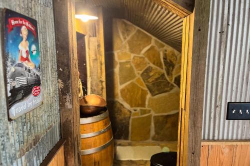 a doorway to a room with barrels and a sign at Walk to Trails & Fishing Spots! Lake Ozark Escape in Four Seasons