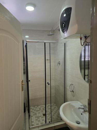 a bathroom with a shower and a sink at One Bedroom Apartment B in Kempton Park