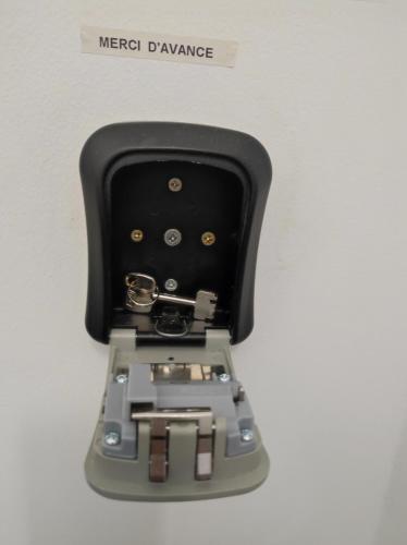 a electronic device with a metal drawer at L'escapade CDG Astérix Parc d'exposition in Louvres