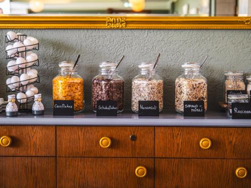 a display of jars of food on a counter at Faaker See Inn by Aurora in Faak am See