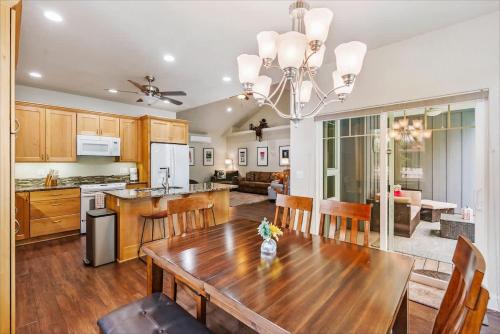 a kitchen and dining room with a wooden table at Schweitzer & Dover Bay - Ski Lake Dine in Dover