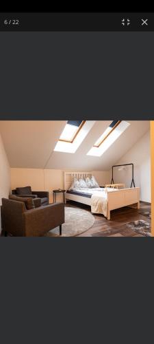 a bedroom with a bed and skylights in the ceiling at Apartment Andras in Murau