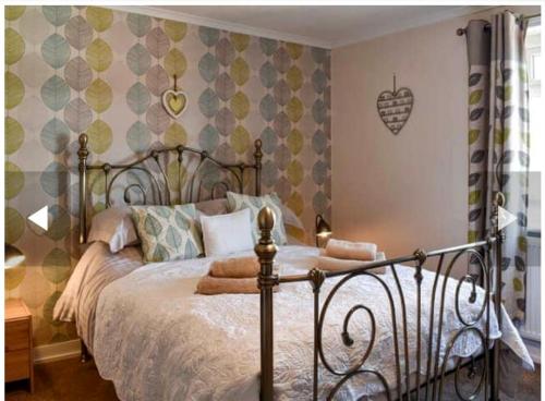 a bedroom with a bed with a metal frame at Annie Place in Whitby