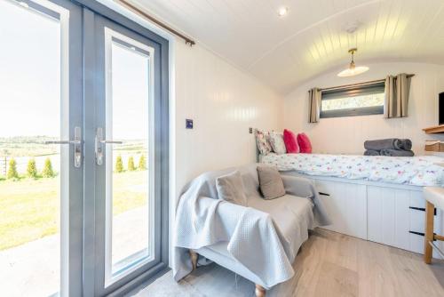 a bedroom with a bed and a sliding glass door at 1 Bed in Narberth oc-83862 in Whitland