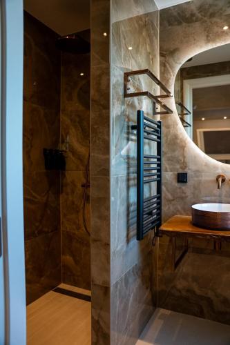a bathroom with a sink and a shower at Room4 in Maurik