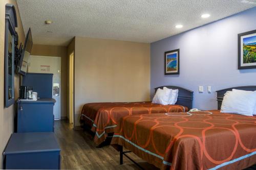 a hotel room with two beds in a room at Orange Tustin Inn in Orange in Orange