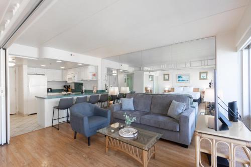 a living room with a couch and a table at Ilikai Tower 1538 condo in Honolulu