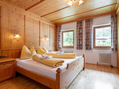 a bedroom with a bed in a wooden room at Zellner Top 9 in Alpbach