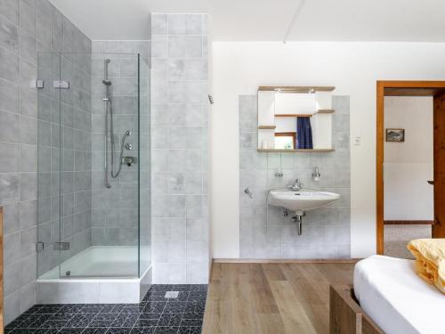 a bathroom with a shower and a sink at Zellner Top 9 in Alpbach