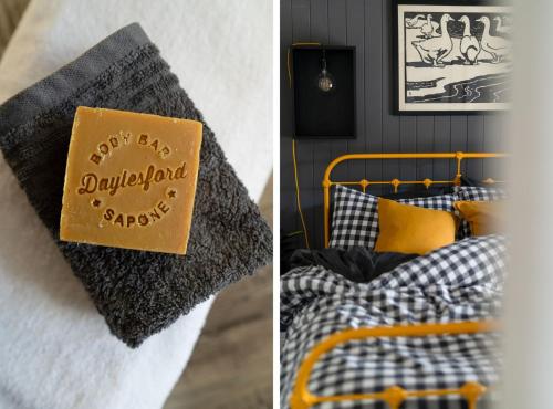 a bedroom with a bed with a sign on it at The Duckling in Glenlyon