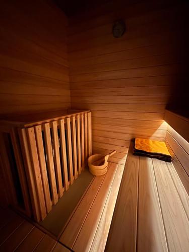 an inside of a sauna with a book on the floor at LadolcevitA - 総檜サウナ - Private Hinoki Sauna Inn in Mitsugoe