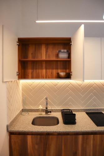 a kitchen with a sink and a counter top at Calle y Número, San Felipe in Guadalajara
