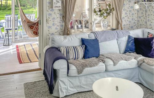 a living room with a couch and a table at Amazing Home In Luleå With Sauna in Luleå