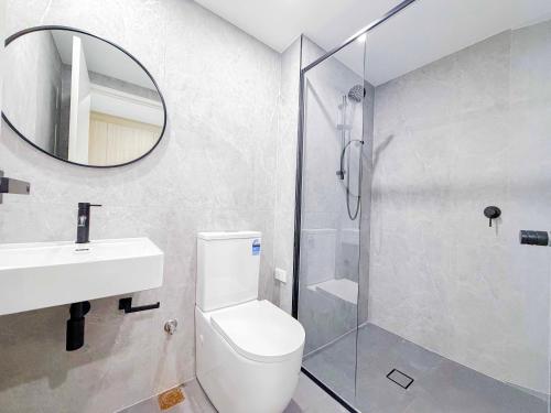 a bathroom with a shower and a toilet and a sink at Auburn Studio, Entire Studio with Ensuite toilet and kitchen in Sydney