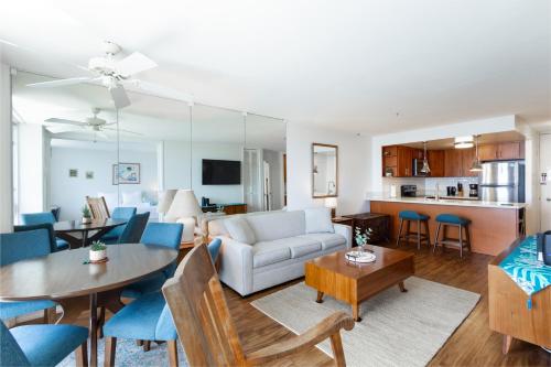 a living room with a couch and a table at Ilikai Marina 1394 in Honolulu
