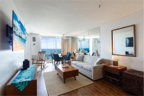 a living room with a couch and a table at Ilikai Marina 1394 in Honolulu