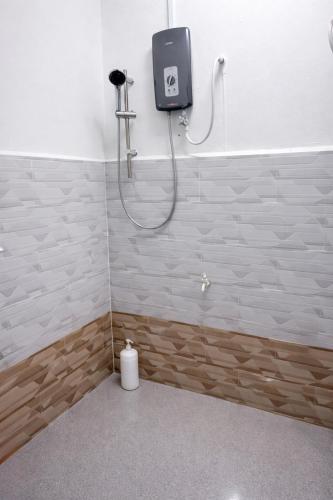 a bathroom with a shower with a toilet at DNH Nilam Puri Homestay Unit C in Kota Bharu