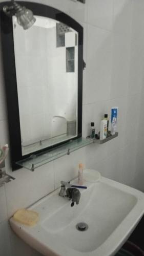 a bathroom sink with a mirror above it at RanaHansa Villa in Kegalle