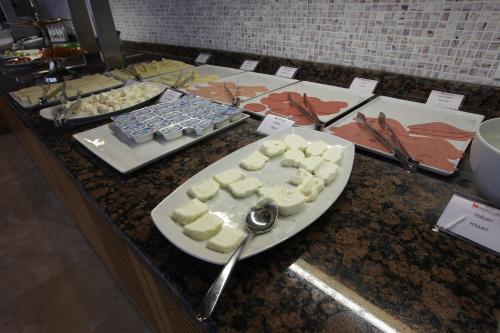 a table with a plate of food on a counter at Orucoglu Oreko Hotel in Manisa
