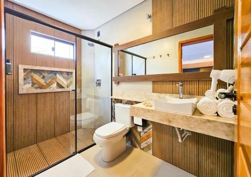 a bathroom with a toilet and a shower and a sink at Sant copacabana in Rio de Janeiro