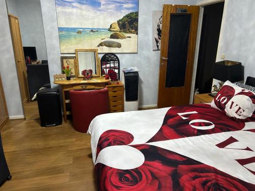 a bedroom with a bed with a red and white blanket at Serenity Big Room in Brussels