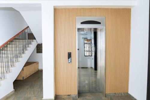 a hallway of a house with a striped wall at Star Hotel & Suites in Abuja