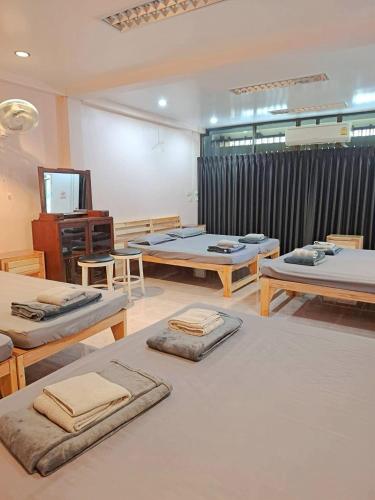 a room with several mattresses on the floor at Padang Besar In front of Border Private room & Hostel in Sathani Padang Besa