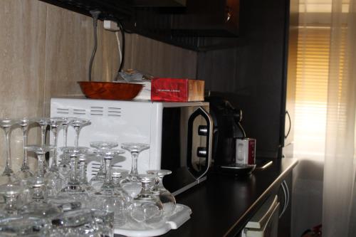 a group of wine glasses on a counter in a kitchen at Casa Sofia in Bucharest