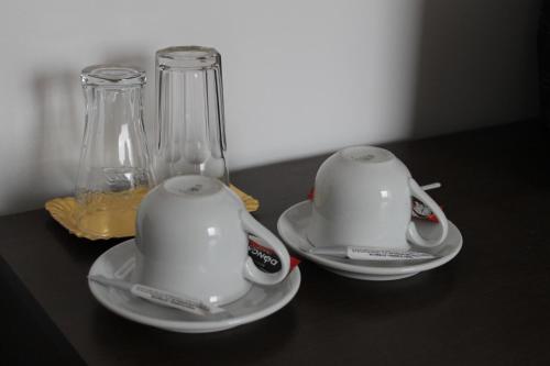 two tea cups and a blender on a table at Casa Sofia in Bucharest