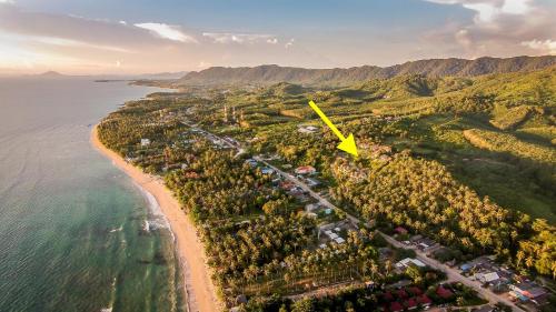 an aerial view of a beach with a yellow arrow at 6 Bedrooms Seaview With Pool - Belle Sunset Villa in Ko Lanta