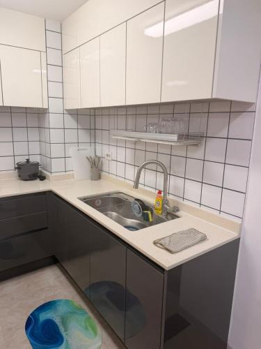 a kitchen with a sink and a counter top at clark terrace condo with 2bedroom near airport hann casino in Tibo
