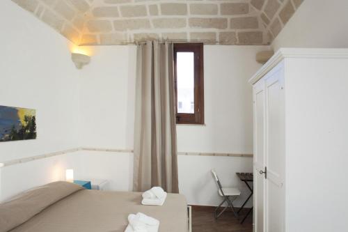 Postel nebo postele na pokoji v ubytování B&b Il Tufo
