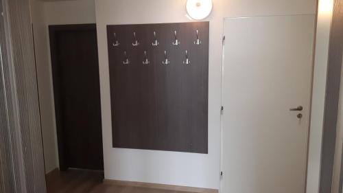 a room with a wall with a window and a door at Apartmany Agatha in Loučná nad Desnou
