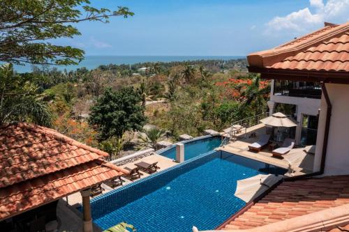 a view of a swimming pool from a house at 2 Pools And Seaview! Villa Serena 6Br, Klong Khong in Ko Lanta