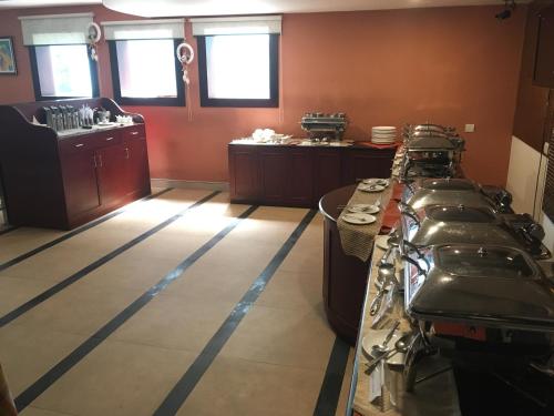 a room with a row of counters in a kitchen at Cochin Palace in Cochin