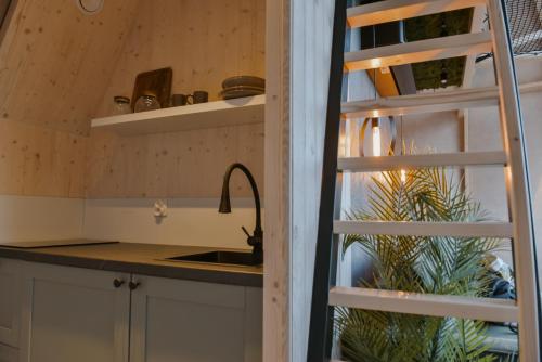 a kitchen with a sink and a counter top at AtmoSphere Czorsztyn in Czorsztyn