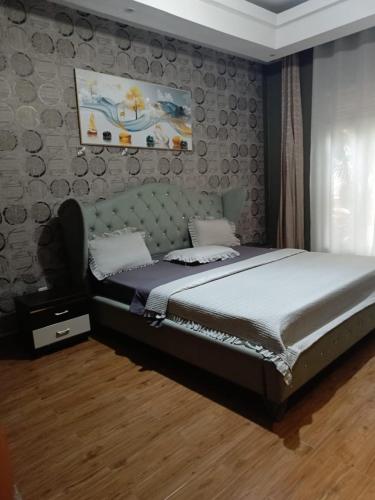 a bedroom with a bed in a room at Cameo Villa in Kigali