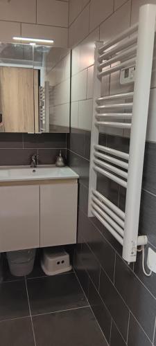a bathroom with a sink and a mirror at maison cosy pour 4 à 5 personnes 10mns des plages in Sanary-sur-Mer