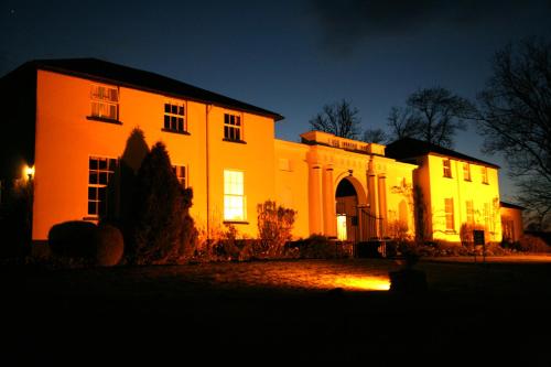 a building at night with its lights on at Lord Haldon Country Hotel, Sure Hotel Collection by Best Western in Exeter