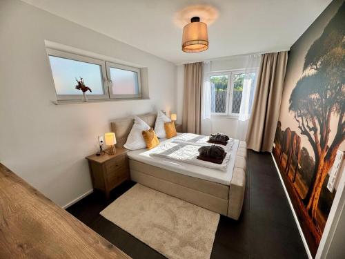 a small bedroom with a bed and a window at Zuri Suite in Rittersdorf