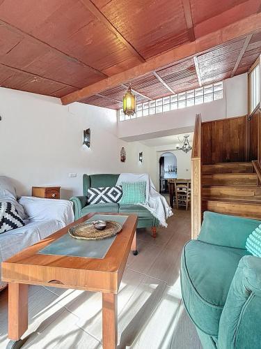 a living room with a couch and a table at Torre Santo Dios in Iznájar
