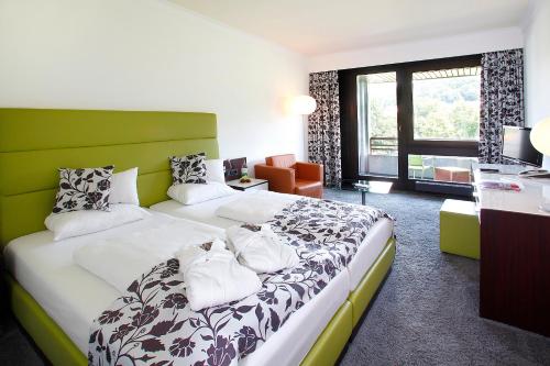 Postel nebo postele na pokoji v ubytování Hotel an der Therme