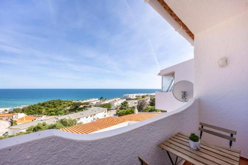 a balcony with a view of the ocean at incredible view- T1 Salema in Salema