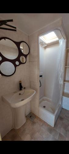 a bathroom with a toilet and a sink and a shower at Sunny Quiet Nest in Jūrmala