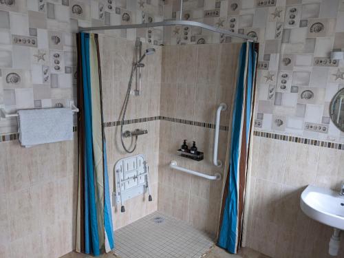 a shower stall in a bathroom with a sink at Dunloe View in Killarney