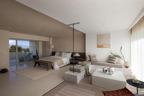 a bedroom with a bed and a living room at WHITEBALANCE Hotel Dali in Dali