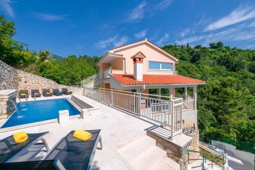 a villa with a swimming pool and a house at Villa Pia by Briskva in Brseč