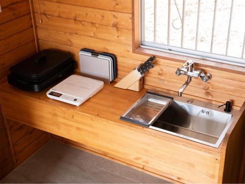 a kitchen counter top with a sink and a sink at rinne 那須 Garden 3 in Nasu