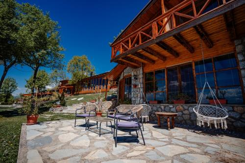 a patio with chairs and a table in front of a building at Paradise Nest in Ohrid